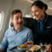 United inflight dining tray with plated entrée, mug of coffee, and cabin window