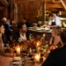 Bon Ami pop-up style table with shared plates, candles, and wine glasses