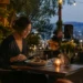Solo dining experience at a small table with coffee and a plated meal
